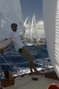 Mike & Metani: Mike holding the main boom in light wind as we pass our Australian friends Metani